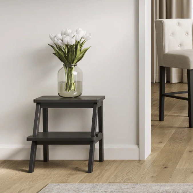 Small black bedroom stool for everyday tasks