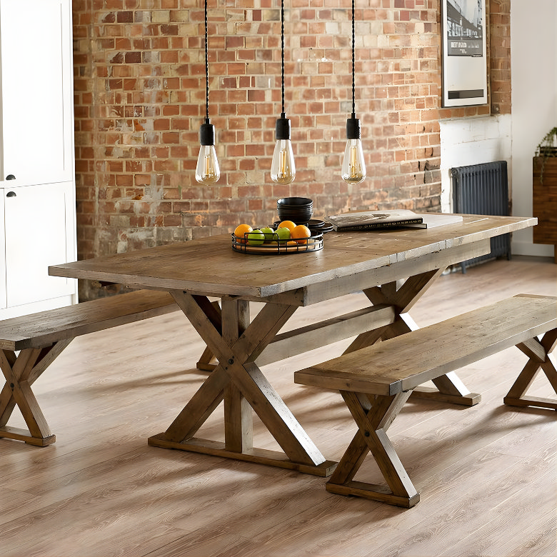 exposed bulb pendant lights over dining table with industrial style