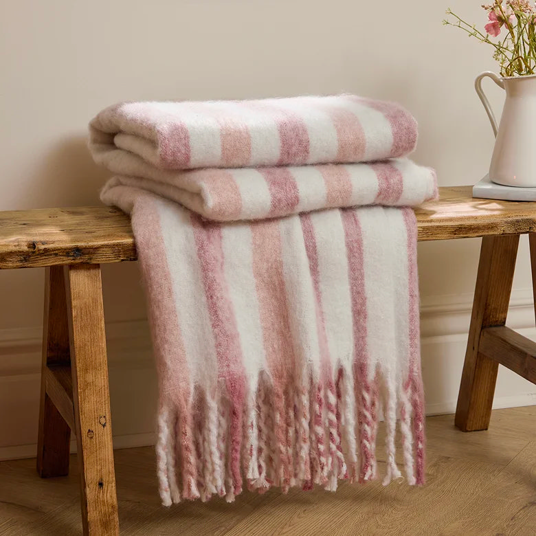 pink and white striped christmas throw