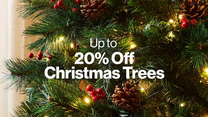 Christmas tree zoomed in and text that reads - up to 20% off christmas trees