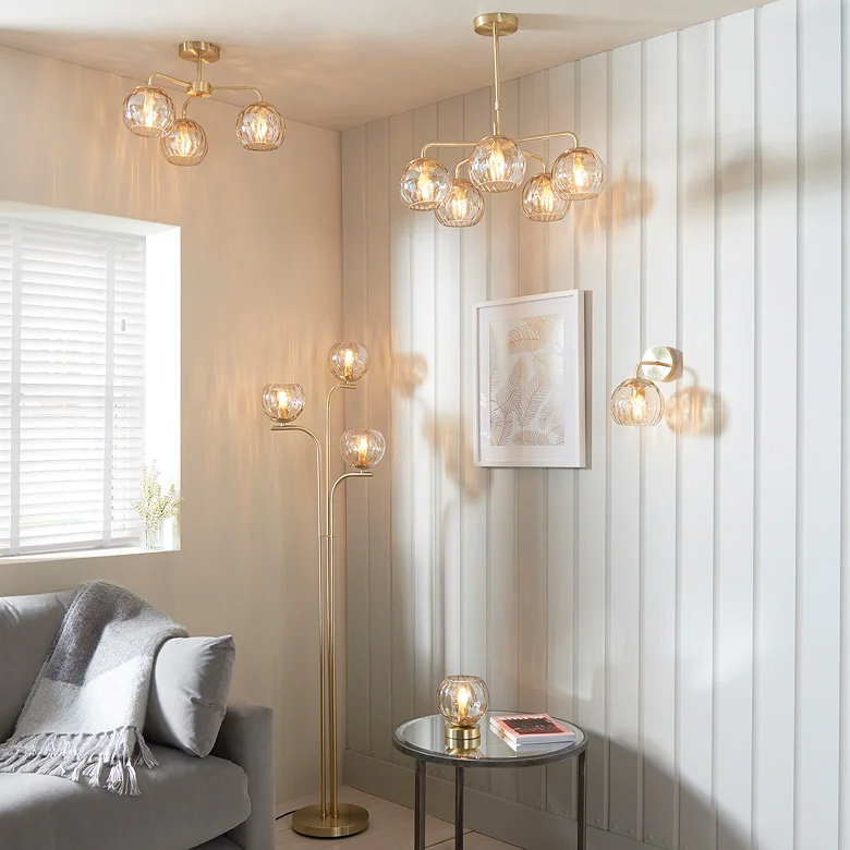 layered living room lighting with glass pendant lights