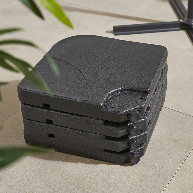 close up image of four corners of parasol base stacked on top of one another