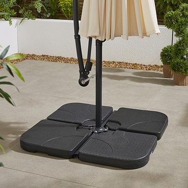 close up image of four corners of parasol base stacked on top of one another