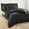 Complete Plain Dye collection in Black on bed image 4