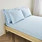 mattress on a bed covered with light blue fitted sheet in 30cm depth, with matching pillowcases