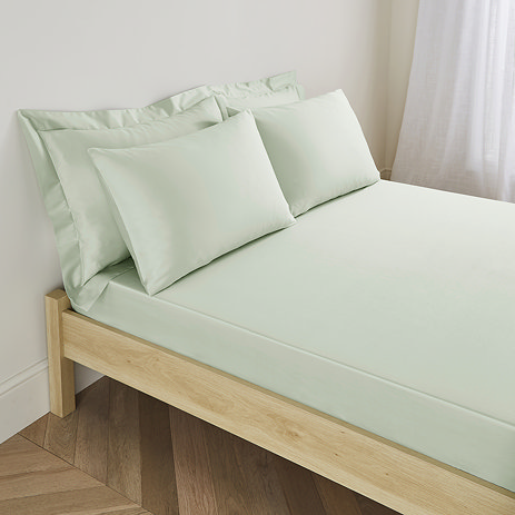 Deep fitted sheet in sage on bed image 1