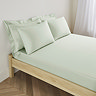 Deep fitted sheet in sage on bed image 1