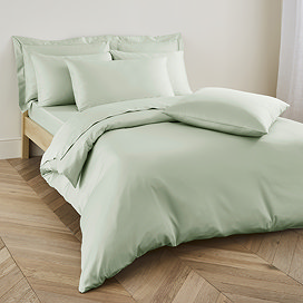 Duvet cover in sage on bed image 1