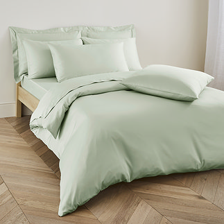 Duvet cover in sage on bed image 1