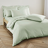 Duvet cover in sage on bed image 1