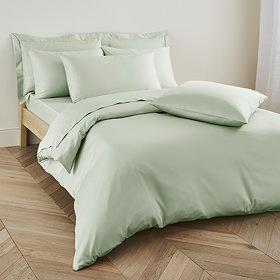 Duvet cover in sage on bed image 1