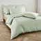 Duvet cover in sage on bed image 1