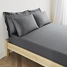 mattress on a bed covered with charcoal grey fitted sheet in 40cm depth, with matching pillowcases