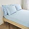 mattress on a bed covered with light blue fitted sheet in 40cm depth, with matching pillowcases