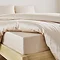 Extra deep fitted sheet in natural close up on bed image 2