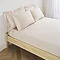 Extra deep fitted sheet in natural on bed image 1