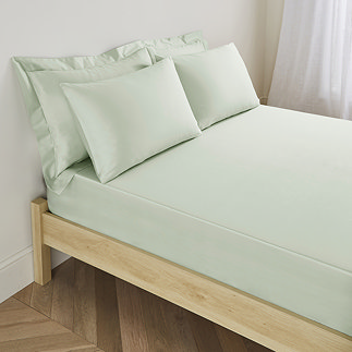 Extra Deep Fitted Sheet in sage on bed image 1