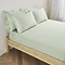 Extra Deep Fitted Sheet in sage on bed image 1