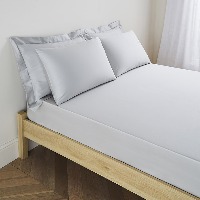 mattress on a bed covered with fitted sheet in 40cm depth, with matching pillowcases