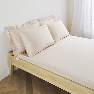 Natural Fitted Sheet on bed image 1