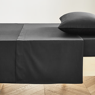 Flat Sheet in Black on bed image 1