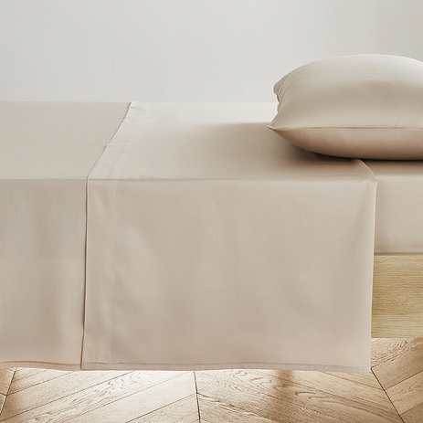 Flat Sheet in natural on bed image 1