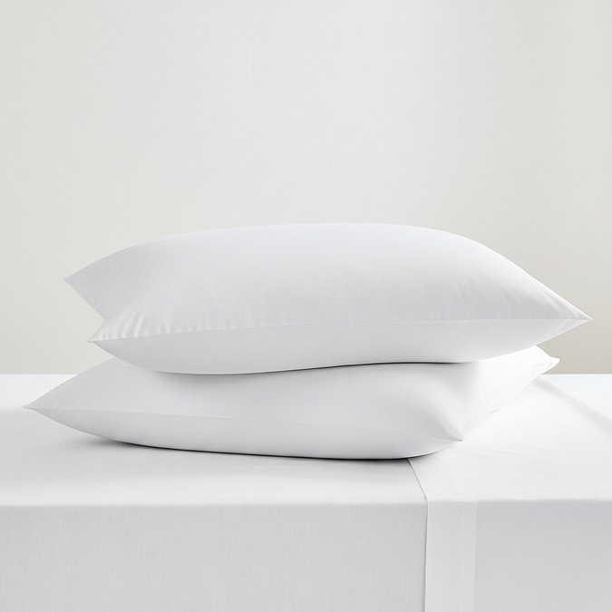 Pair of white king size pillowcases