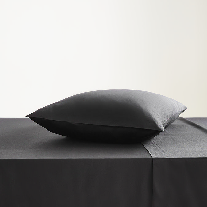 Kingsize pillowcase in black on bed image 2