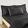 Kingsize pillowcase in black on bed image 1