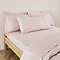 Kingsize Pillow in Blush on a bed image 1