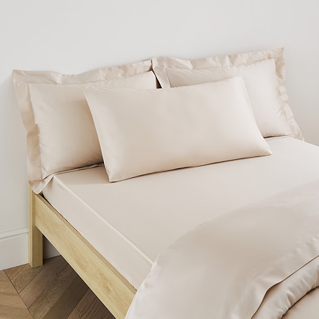 Kingsize Pillow in Natural on a bed image 1