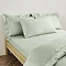 Plain Dye Kingsize Pillowcase in Sage on bed image 1
