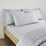 Kingsize Pillow in Silver on a bed image 1