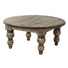 image cut out on white background of round rustic dark brown coffee table with carved legs