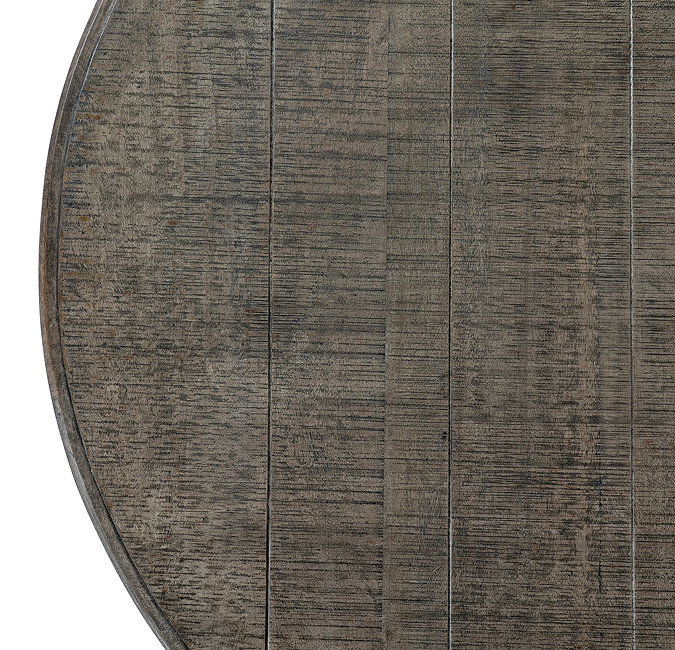close up image of dark brown tabletop of rustic round dining table