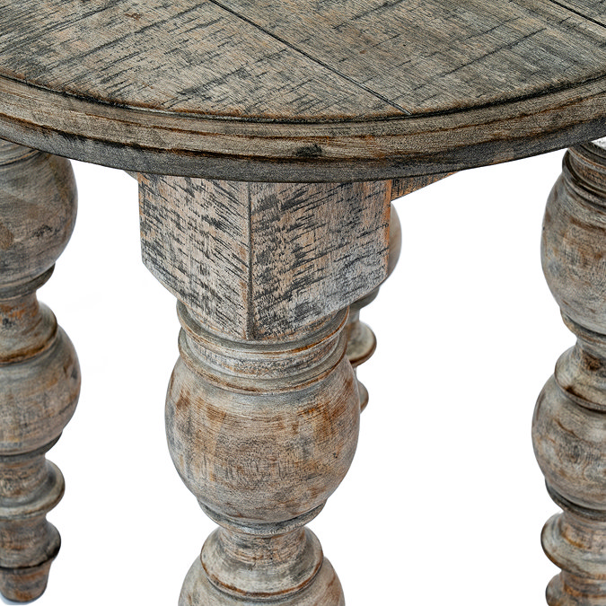 close up image of carve detail legs of dark oak rustic round side table