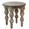 image cut out on white background of round rustic dark brown side table with carved legs