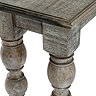 close up image of corner of dark wood console table