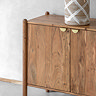 close up image of acacia wood four door sideboard with gold handles