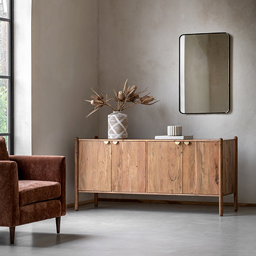 close up image of acacia wood four door sideboard with gold handles