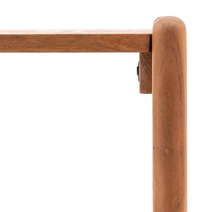 close up on slim, curved structure of console table
