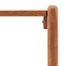 close up on slim, curved structure of console table