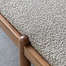 close up on grey boucle material of dining bench