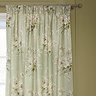 Adele Sage Green Floral Pencil Pleat Curtains in front of a window close up image