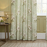 Adele Sage Green Floral Pencil Pleat Curtains in front of a window close up image