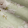 Adele Sage Green Floral Pencil Pleat Curtains in front of a window close up image
