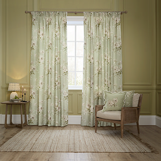Adele Sage Green Floral Pencil Pleat Curtains in front of a window image
