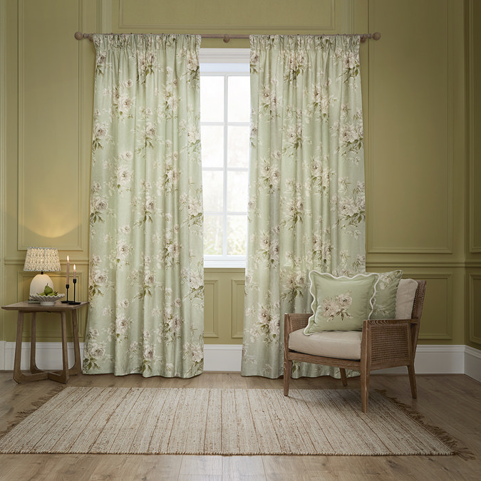 Adele Sage Green Floral Pencil Pleat Curtains in front of a window image
