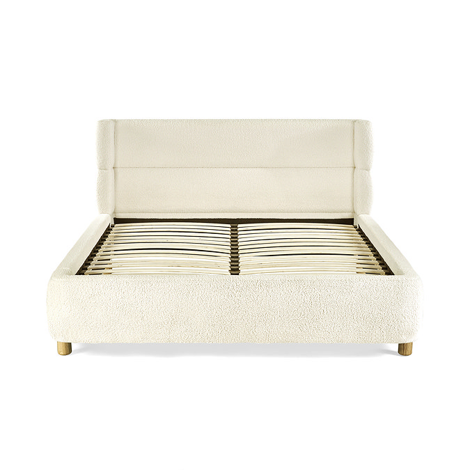 front on image cut out on white background of slatted bed with beige boucle bedframe