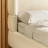 close up image of beige boucle bedframe